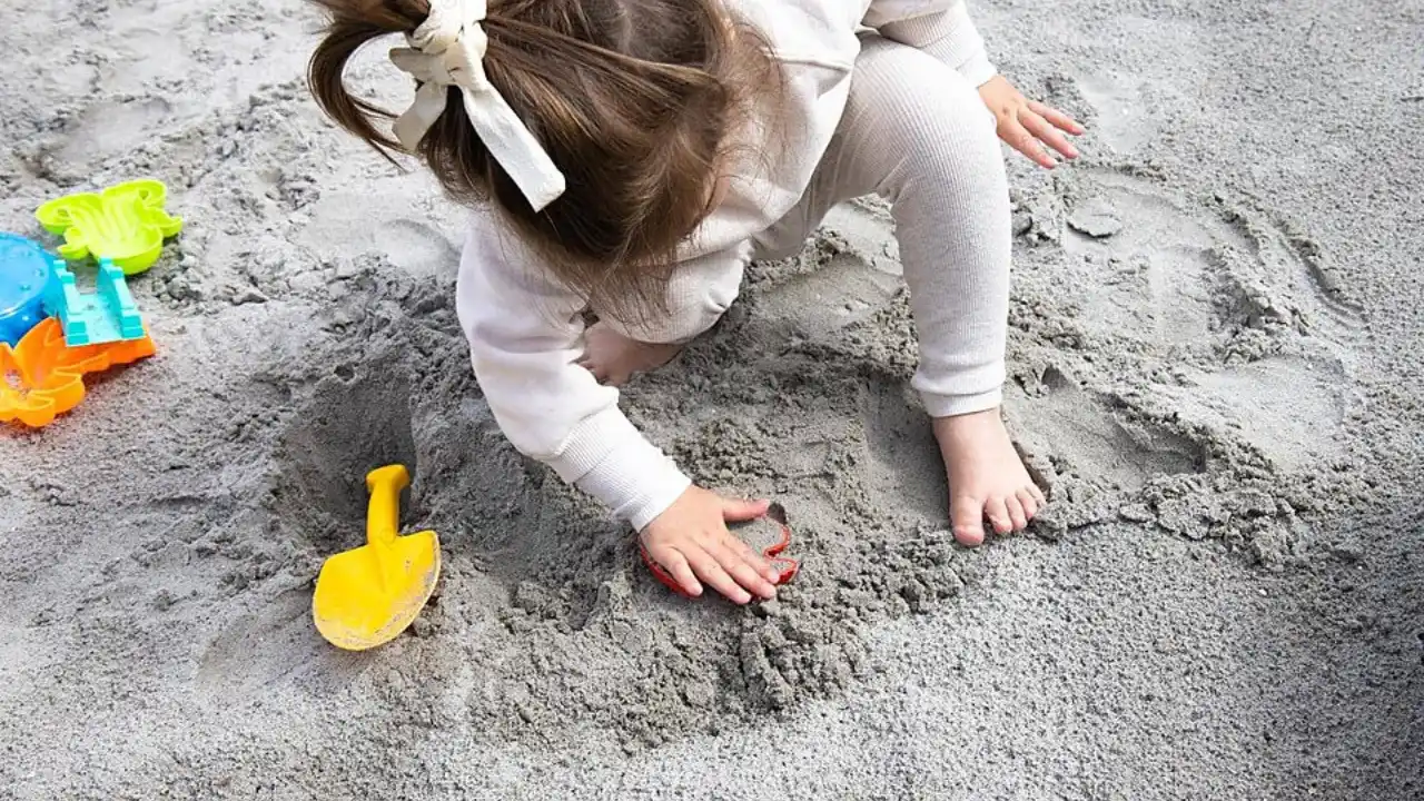 How to Sanitize Sandbox Sand 3 A girl is having fun in a sandbox 2